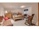 Finished basement bedroom with log-frame bed and comfortable furniture at 2912 Lake Park Way, Longmont, CO 80503