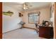 Bright bedroom with a window, ceiling fan, desk area, and whimsical decor for a functional living space at 2912 Lake Park Way, Longmont, CO 80503