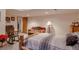 Finished basement bedroom with log-frame bed and comfortable furniture at 2912 Lake Park Way, Longmont, CO 80503