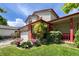 Front exterior of home with attached garage, colorful flowers and a covered porch at 2912 Lake Park Way, Longmont, CO 80503