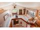 Open living room featuring a vaulted ceiling, a decorative deer head, and stairs leading to the second level at 2912 Lake Park Way, Longmont, CO 80503
