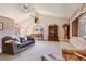 Bright living room featuring vaulted ceilings, classic furniture, and a large window with natural light at 2912 Lake Park Way, Longmont, CO 80503