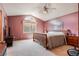Primary bedroom features a vaulted ceiling, neutral carpet, and lots of light from the large windows at 2912 Lake Park Way, Longmont, CO 80503