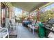 Relaxing covered patio with seating area and outdoor grill at 2912 Lake Park Way, Longmont, CO 80503