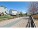 Beautiful backyard with lush green grass, stone path, and partial fencing, perfect for outdoor enjoyment at 5506 S Quemoy Cir, Aurora, CO 80015