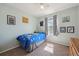 Bright bedroom with light green walls, playful decorations, and a cozy single bed at 5506 S Quemoy Cir, Aurora, CO 80015