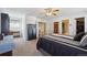 Spacious bedroom featuring neutral walls, a full bed, a ceiling fan, and a closet at 5506 S Quemoy Cir, Aurora, CO 80015