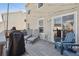Inviting deck with lounge chairs, Adirondack chairs, and string lights, a great spot to relax outdoors at 5506 S Quemoy Cir, Aurora, CO 80015