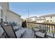 Spacious deck featuring lounge chairs, dining set, and string lights, perfect for outdoor relaxation and entertaining at 5506 S Quemoy Cir, Aurora, CO 80015