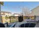 Outdoor deck with seating, string lights, and a grill, perfect for entertaining at 5506 S Quemoy Cir, Aurora, CO 80015
