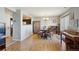 Bright dining area with hardwood floors, a chandelier, a decorative cabinet and natural light at 5506 S Quemoy Cir, Aurora, CO 80015