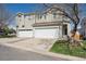 Charming two-story home with a two-car garage and a well-manicured lawn, perfect for curb appeal at 5506 S Quemoy Cir, Aurora, CO 80015
