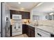 Well-equipped kitchen featuring granite counters, and stainless steel appliances at 5506 S Quemoy Cir, Aurora, CO 80015