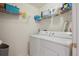 Functional laundry room with washer, dryer, and storage shelving at 5506 S Quemoy Cir, Aurora, CO 80015