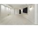 Spacious basement area with neutral carpet, recessed lighting, and a modern entertainment center at 2832 Danbury Ave, Highlands Ranch, CO 80126