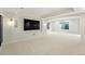 Large basement featuring recessed lighting, neutral carpet, and a modern entertainment center at 2832 Danbury Ave, Highlands Ranch, CO 80126