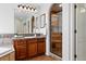 Bathroom with a beautifully tiled shower and granite countertop vanity at 2832 Danbury Ave, Highlands Ranch, CO 80126