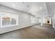 Versatile bonus room with windows and a mirrored wall, ideal for recreation or fitness at 2832 Danbury Ave, Highlands Ranch, CO 80126