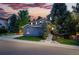 Attractive multi-story home with stone accents and a professionally landscaped front yard at 2832 Danbury Ave, Highlands Ranch, CO 80126