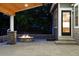 Well-lit patio with a stone fire pit and wood ceiling offers a cozy outdoor entertaining space at 2832 Danbury Ave, Highlands Ranch, CO 80126