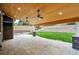 Spacious patio with a wood ceiling, ceiling fans, stone pillars, and a backyard that is perfect for entertaining at 2832 Danbury Ave, Highlands Ranch, CO 80126