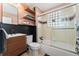 Chic bathroom featuring a glass-enclosed shower, a modern vanity, and open shelving at 511 S Pennsylvania St, Denver, CO 80209