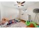 Bright bedroom with plush rug, colorful quilt, and white dresser offering ample storage at 511 S Pennsylvania St, Denver, CO 80209