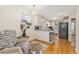Charming kitchen featuring hardwood floors, bright white cabinets, and lots of natural light at 511 S Pennsylvania St, Denver, CO 80209