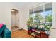 Bright living room with hardwood floors, a large window with lots of natural light, and cozy furnishings at 511 S Pennsylvania St, Denver, CO 80209