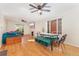Open-concept living room featuring hardwood floors, modern furniture, large windows, and a decorative fireplace at 511 S Pennsylvania St, Denver, CO 80209