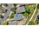 Aerial shot of this property's backyard, roof, and street including neighbor's homes and trees at 13323 Birch Cir, Thornton, CO 80241