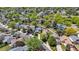 Aerial view of a suburban neighborhood, with lush green trees and well-maintained homes at 13323 Birch Cir, Thornton, CO 80241