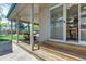 Covered back porch perfect for entertaining with a picnic table, outdoor seating, and backyard views at 13323 Birch Cir, Thornton, CO 80241