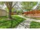Backyard features a walking path and retaining wall perfect for outdoor activities at 13323 Birch Cir, Thornton, CO 80241