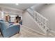 Finished basement area with cozy seating, entertainment center, and stairs leading to the upper level at 13323 Birch Cir, Thornton, CO 80241