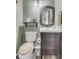 Charming half bathroom with sleek vanity, framed mirror, and modern fixtures offers comfort at 13323 Birch Cir, Thornton, CO 80241