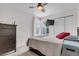 Well-lit bedroom features two windows, closet, comfortable bed, soft carpet and dark furniture at 13323 Birch Cir, Thornton, CO 80241