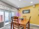 Charming dining area with a sliding door that leads to the patio, perfect for indoor/outdoor living and entertaining at 13323 Birch Cir, Thornton, CO 80241