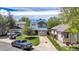 Charming two-story home with well-manicured lawn, driveway with parking, and inviting curb appeal at 13323 Birch Cir, Thornton, CO 80241