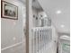 Second floor hallway shows white railing, carpeted floor, recessed lighting and neutral paint at 13323 Birch Cir, Thornton, CO 80241