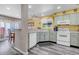 Well-lit kitchen features a functional layout, efficient appliances, and convenient access to the dining area at 13323 Birch Cir, Thornton, CO 80241
