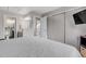 Primary bedroom boasts neutral walls, closet, ensuite bath and comfortable sleeping space at 13323 Birch Cir, Thornton, CO 80241