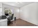 Bedroom features a built-in desk, chair, computer, and a window letting in lots of natural light at 8825 Fairview Oaks Pl, Lone Tree, CO 80124
