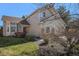 Charming home with a well-manicured front yard and a welcoming entrance at 8825 Fairview Oaks Pl, Lone Tree, CO 80124
