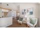 Bright living room with a staircase, a large window, and comfortable seating at 8825 Fairview Oaks Pl, Lone Tree, CO 80124