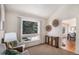 Bright living room with neutral walls, a big window, and a view into the dining area at 8825 Fairview Oaks Pl, Lone Tree, CO 80124