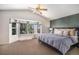 Spacious main bedroom with vaulted ceilings, a bay window, and a ceiling fan with light fixture at 8825 Fairview Oaks Pl, Lone Tree, CO 80124
