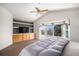 Beautiful main bedroom with a bay window, built-in shelves, cabinets, and vaulted ceilings at 8825 Fairview Oaks Pl, Lone Tree, CO 80124