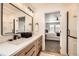 Bathroom with granite vanity, black hardware, and view to the main bedroom at 1896 Hogan Ct, Castle Rock, CO 80109