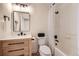 Bathroom with granite vanity, shower/tub combo, and black hardware at 1896 Hogan Ct, Castle Rock, CO 80109